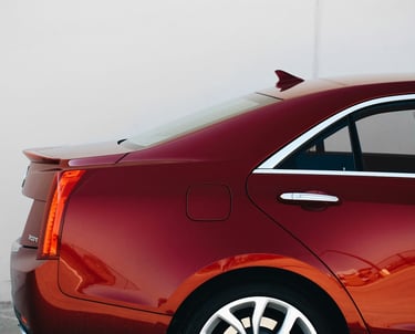 a red car parked in a parking lot
