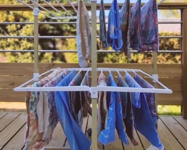 a clothes rack with clothes hanging on it