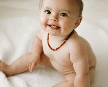 a baby sitting about 6 months old, taken in a natural light studio in Adelaide Hills