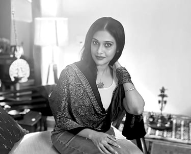 a woman sitting on a bench in a room