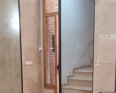 a mirror in a room with a guitar case