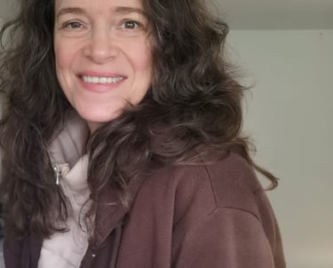 a woman with long hair and a scarf around her neck