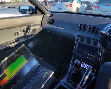 a car driving down a highway with a laptop computer