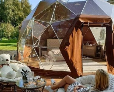 a woman sitting on a chair in a patio