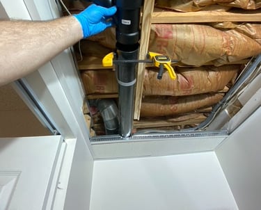 plumbing repair on a 3 inch drain line tee in basement ceiling with insulation