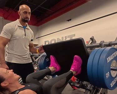 a man and woman doing a sit up on a bench