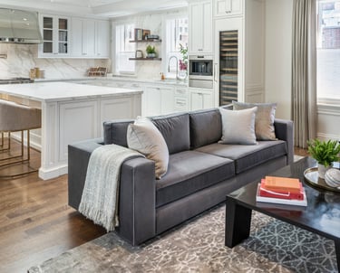 a living room with a couch and a table