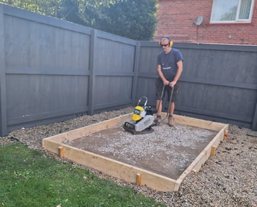 a man operating a compactor plate