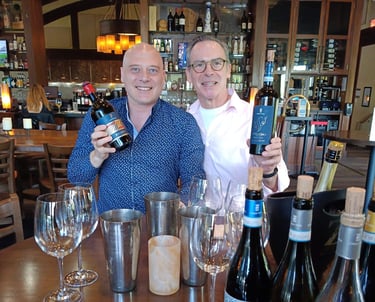 wine professional and wine producer showcasing their newly imported selections
