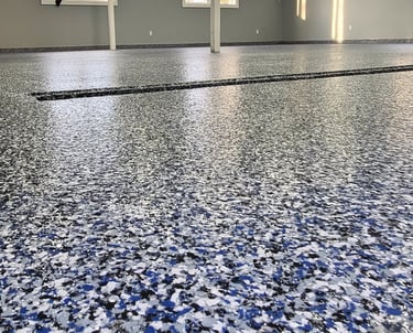 Residential garage floor coating with blue flake using MMA system, drain coated epoxy membrane