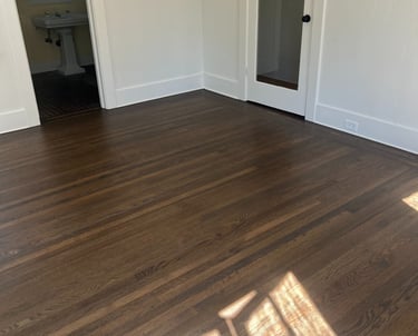 a room with a wooden floor and a door