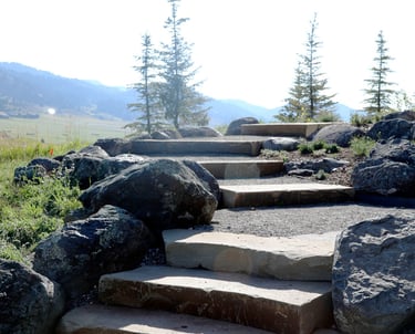 a stone steps leading up to a stone stepstone