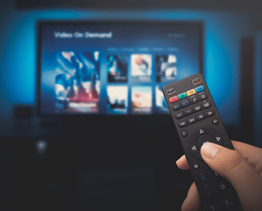 a person holding a remote control and needing support. troubleshooting