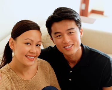 a man and woman sitting on a couch