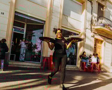 Waitress leaving Santa Lola Badalona with trays and good vibes
