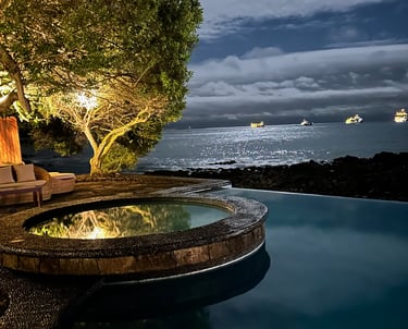 Outdoor pool area at Villa Escalesia Galapagos, offering a relaxation space within a refi