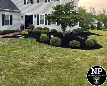 excellent landscaping and hardscaping of grass, stones and trees by NP Landscaping