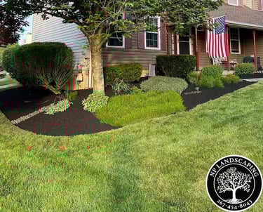 excellent landscaping and hardscaping of grass, stones and trees by NP Landscaping