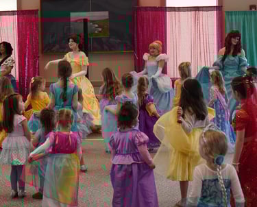 Princesses perform a dance at a ball