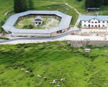 farm house malga misurina with a circular shaped building