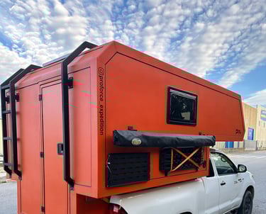 pick-up truck red camper