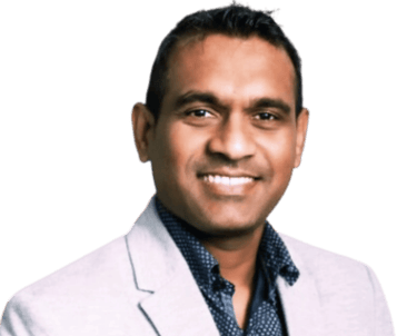 Ranil Fernando, Mortgage Agent Level 2 at MortgageWell Ontario, navy shirt and grey blazer smiling