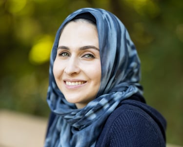 a mental health therapist in a blue scarf and scarf around her neck