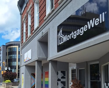 Street view of MortgageWell building in Cornwall with a sign reading 'Today’s Best Mortgage Rate"