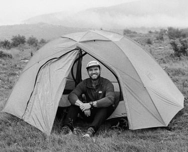 35mm film Nate Bowery sitting in tent while backpacking at Grayson Highlands State Park in Virgina