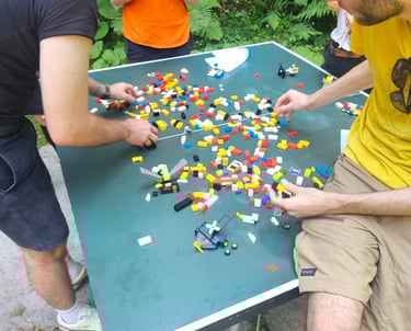 a man and a woman playing a game of legos