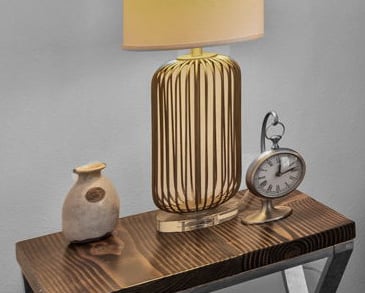 a lamp that is sitting on a table with accents