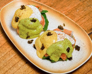 a plate of salmon egg benedict