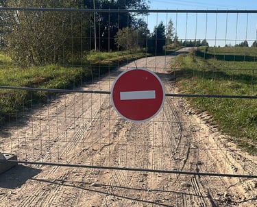 a closed gate which indicates a closed gravel road section for a private pre event rally tests (PET)