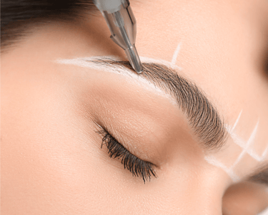 A female client undergoing the brow mapping process for permanent makeup in Oklahoma City, with prec