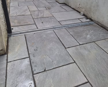 I freshly tiled ground with neatly fitted drains