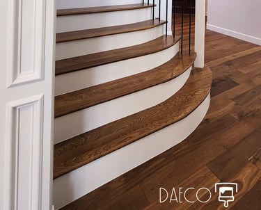 a staircase leading to a foyer with a chandelier - Denver Luxury Home Painting