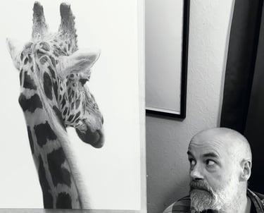 A photo of Will Arden with a drawing of a giraffe