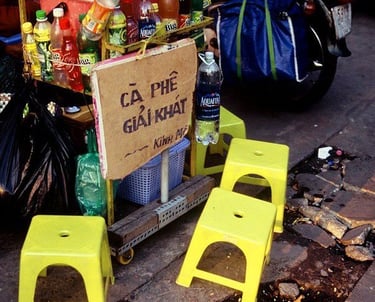 Plastic chairs in Saigon on a pavement coffee stall