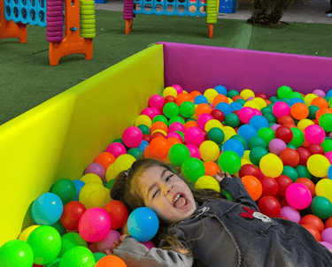 a child's play area with a ball pit in petit brunch in barcelona