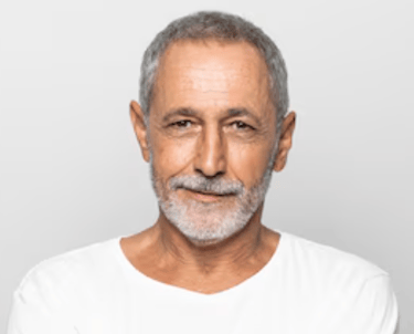 a man with a beard and a white shirt Martin PE / COACH