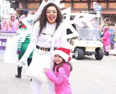 Snowflake skater poses with a kid for a photo