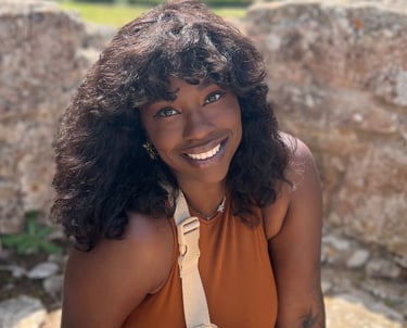 a woman in a tan top