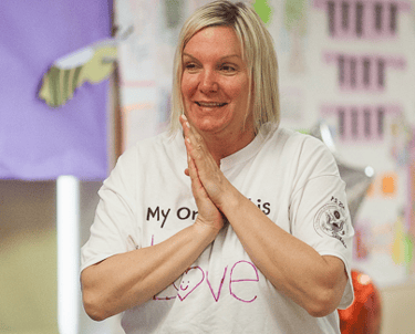 NaliniKIDS program teacher smiles.