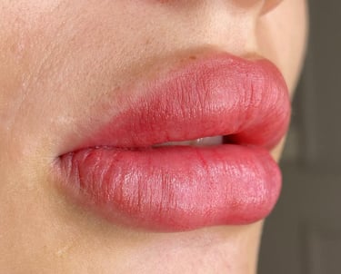 a woman with a red lip and a red lip LIP BLUSH