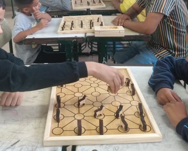 a group of people playing chess in a classroom
