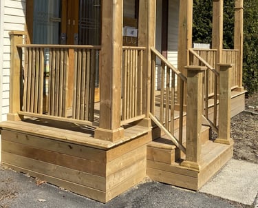 a porch with a wooden porch and a wooden porch