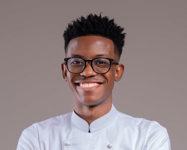 a man in a chef's uniform and glasses