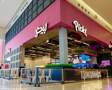 Pickl fast food branch in nakheel mall, featuring bold pink branding, sleek hospitality design, and vibrant F&B atmosphere.