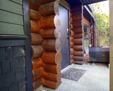 log home chink and staining by Vancouver Island log house restoration company Embassy Restorations