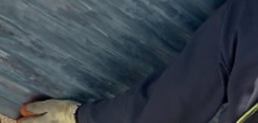 Scaffolder harnessed to scaffolding